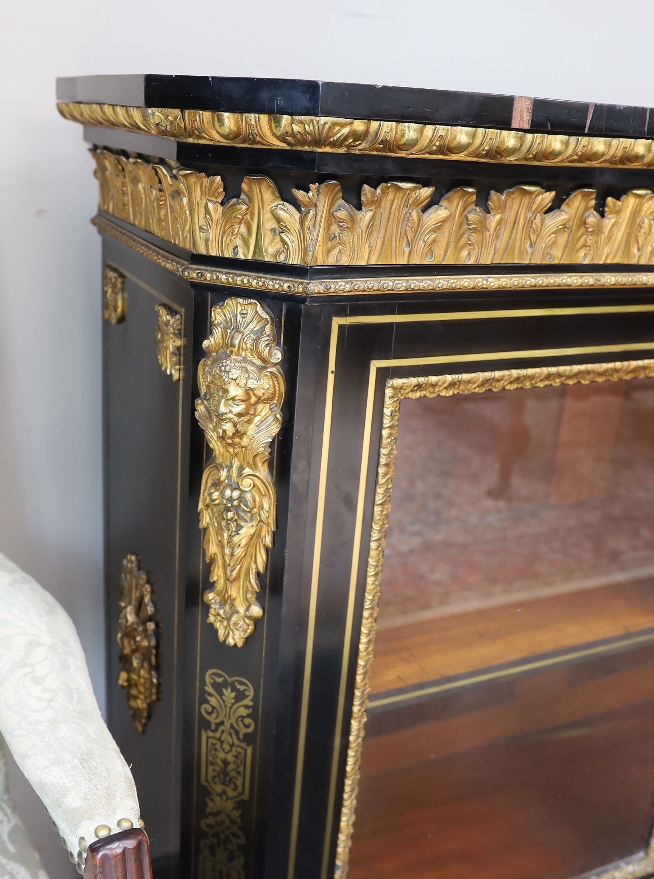 A 19th century French gilt metal mounted ebonised two door side cabinet, width 140cm, depth 38cm, height 107cm
